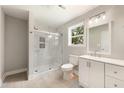 A newly renovated bathroom with a glass shower and neutral tones at 1006 S Second Ave Ave, Siler City, NC 27344