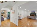 Spacious living room with hardwood floors, fireplace, and ample natural light at 1023 Cleland Dr, Chapel Hill, NC 27517