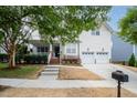 Beautiful two-story home featuring an attached two-car garage and a well-maintained front yard at 10847 Bedfordtown Dr, Raleigh, NC 27614