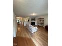 Cozy living room featuring a fireplace and hardwood floors at 110 Knightwood Dr, Durham, NC 27703