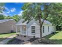 Exterior home view of a charming home with curb appeal, and mature trees at 1202 Kendall Dr, Durham, NC 27703