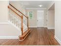 Welcoming entryway features hardwood floors, staircase and ample natural light from the adjacent windows at 1304 Barnford Mill Rd, Wake Forest, NC 27587