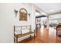 Inviting foyer featuring hardwood floors, a rustic bench, and decorative accents at 1400 Manley Ct, Fuquay Varina, NC 27526