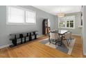 Bright dining room with hardwood floors, modern furnishings, and large windows at 1521 N Duke St, Durham, NC 27701