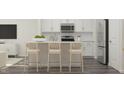 Modern kitchen featuring a large island with seating and stainless steel appliances at 164 Paramount Dr, Smithfield, NC 27577