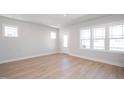 Bright living room with large windows and wood flooring at 1915 Plott Balsam Dr, Wendell, NC 27591