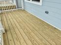 A view of the natural wood planks of the home's front porch at 1915 Plott Balsam Dr, Wendell, NC 27591