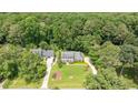 Aerial view of a home surrounded by lush greenery and mature trees at 2008 Corberrie Ln, Raleigh, NC 27613
