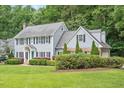 Beautiful two-story home with well-maintained lawn and mature landscaping at 2008 Corberrie Ln, Raleigh, NC 27613
