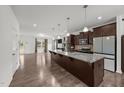 Spacious kitchen with granite countertops, stainless steel appliances, and modern lighting at 2021 W Front St, Burlington, NC 27215