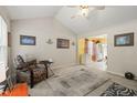 Open living space offering a view into the brightly lit kitchen with yellow walls at 2116 Sterling Creek Ln, Franklinton, NC 27525