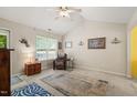 Comfortable living room with a high ceiling, neutral carpet, and a bright window at 2116 Sterling Creek Ln, Franklinton, NC 27525