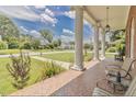 Inviting front porch with decorative tile and comfortable seating, perfect for relaxing outdoors at 219 E Nash St, Spring Hope, NC 27882