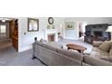 Spacious living room with a cozy fireplace, plush seating, and neutral decor at 219 E Nash St, Spring Hope, NC 27882