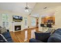 Inviting living room with hardwood floors, fireplace, and vaulted ceilings at 2311 Woodwyck Way, Raleigh, NC 27604