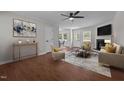 Bright and airy living room featuring hardwood floors, a fireplace, and neutral decor at 2324 Hoskins Rd, Burlington, NC 27215