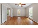 Spacious living room featuring hardwood floors and ample natural light at 3705 Old Post Rd, Raleigh, NC 27612