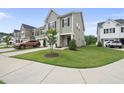 Charming two-story home featuring manicured lawn and neutral siding, complemented by a one car garage at 511 Kenton Mill Ct, Rolesville, NC 27571