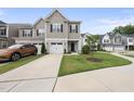 A charming exterior view reveals a well-maintained lawn and a convenient one-car garage at 511 Kenton Mill Ct, Rolesville, NC 27571