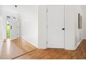 Bright foyer with hardwood floors and a view of the front door at 522 Johnson St, Garner, NC 27529