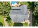 Aerial view showcases the home's roof and surrounding landscape and pool area at 5712 Turner Store Ln, Raleigh, NC 27603