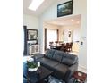 Open concept living area flows into a dining room, enhanced by natural light and modern furnishings at 8600 Colville Ct, Raleigh, NC 27617