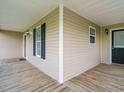 The back porch is a cozy wooden deck, featuring a combination of open space and shaded areas at 110 Westlake Dr, Wendell, NC 27591