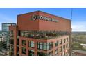 Exterior shot of Quorum Center features brick architecture, signage, and multiple floors with balconies at 122 N Harrington St # 1555, Raleigh, NC 27603