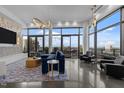 Bright, modern living room features floor-to-ceiling windows, stylish furnishings, and a spacious open layout at 122 N Harrington St # 1555, Raleigh, NC 27603