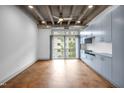 Spacious living area has an exposed ceiling, light blue built-in cabinets and large windows at 1300 St Marys St # 402, Raleigh, NC 27605