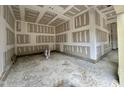 Spacious garage with unfinished walls and ceiling, awaiting your personal touch at 155 Cherry Bark Dr, Youngsville, NC 27596