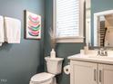 Charming bathroom boasts a sleek vanity, modern toilet, neutral color palette, and stylish decor accents at 1610 Draper View Loop # 101, Raleigh, NC 27608