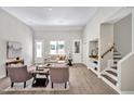 Bright living area with high ceilings and staircase, perfect for entertaining at 1824 Irish Blvd, Sanford, NC 27332