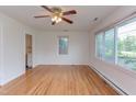 Bright living room with hardwood floors and multiple windows for ample natural light at 2009 Carolina Ave, Durham, NC 27705