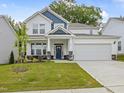 Charming two-story home with a well-manicured lawn and inviting curb appeal at 226 Faith Avenue, Sanford, NC 27330