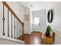 Bright foyer with hardwood floors, decorative accents, and staircase at 238 Lynchwick Ln, Durham, NC 27703