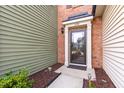 Inviting front door with decorative accents and stylish exterior lighting at 238 Lynchwick Ln, Durham, NC 27703