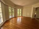 Inviting living room with hardwood floors and French doors allowing abundant natural light at 2428 Perkins Rd, Durham, NC 27705
