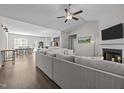 Spacious living room with hardwood floors, vaulted ceiling and cozy fireplace at 244 Lasswade Ct, Zebulon, NC 27597