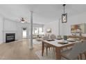 Bright dining area featuring a modern table set, stylish decor, and an open-concept layout at 2621 Asher View Ct, Raleigh, NC 27606