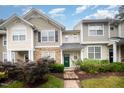 Charming townhome featuring manicured landscaping and inviting green front door at 3519 Sugar Tree Pl, Durham, NC 27713