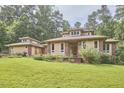 Charming home featuring a two-car garage, light-yellow walls, and a perfectly manicured front lawn at 3605 Laurel Creek Way, Durham, NC 27712