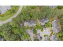 An aerial view shows the community's layout, showcasing its proximity to green spaces and convenient road access at 384 Lyndfield Cl W, Pittsboro, NC 27312