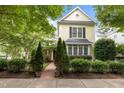 Attractive two-story home with manicured landscaping and a brick walkway leading to the inviting entrance at 4001 Falls River Ave, Raleigh, NC 27614