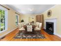 Formal dining room with hardwood floors, traditional decor, and natural light at 417 N Gurney St, Burlington, NC 27215