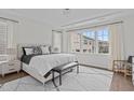 This bedroom boasts natural light with large windows, a comfy bed, and stylish furniture, creating a serene retreat at 520 Flip Trl, Cary, NC 27513