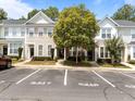 Street view of townhomes and assigned parking spot numbered 5717 in a well-maintained community at 5717 Corbon Crest Ln, Raleigh, NC 27612