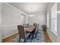 Bright dining room with a dark wood table, upholstered chairs, and a decorative rug, perfect for Gathering dinners at 601 Richlands Cliff Dr, Youngsville, NC 27596