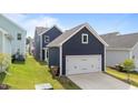 A detached two-car garage complements the home's style, providing ample parking and storage space at 627 Georgias Landing Pkwy, Raleigh, NC 27603