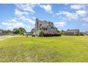 Beautiful home featuring a well-maintained lawn, pool, and basketball court in a desirable neighborhood at 656 Atkins Rd, Fuquay Varina, NC 27526
